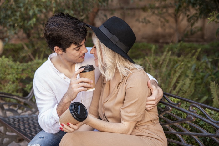 romantic couple on bench at the park
