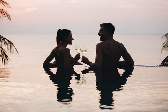 A sugar couple is enjoying the sunset