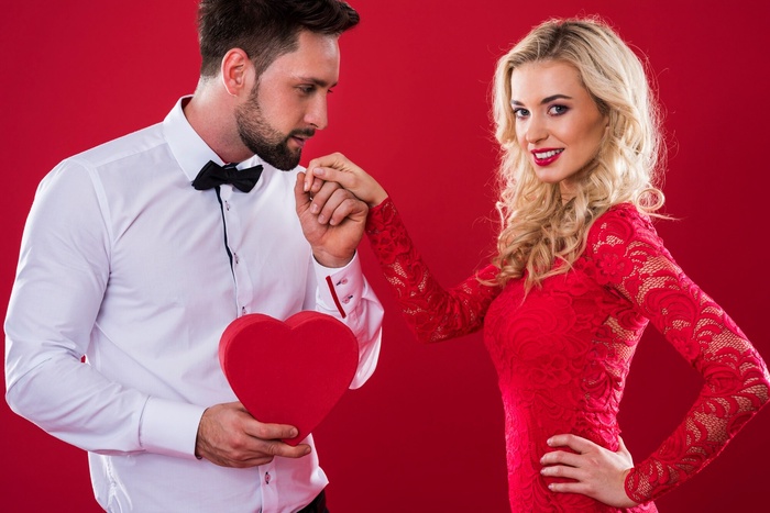 Gentleman gives gift to his female companion during luxury date
