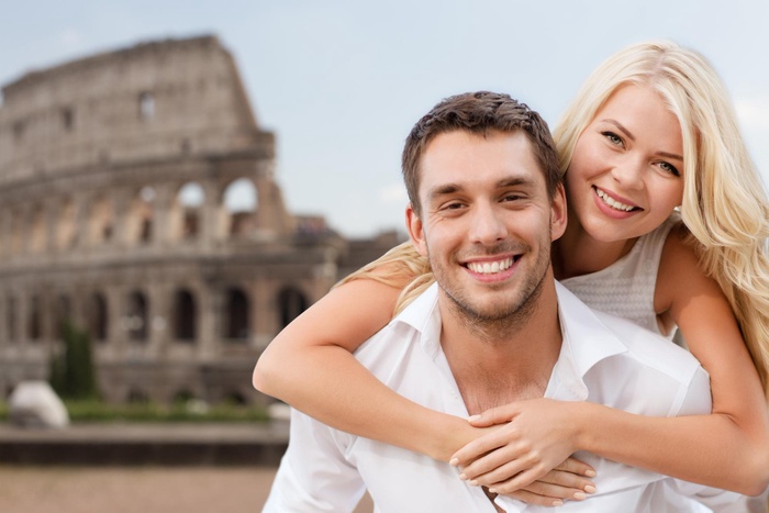 Couple hugging at the Colosseum