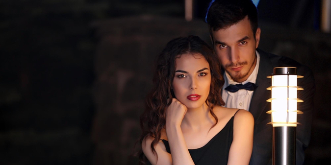 A man hugs a sexy young woman